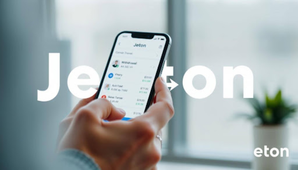 hand holding smartphone with "jeton" written in background